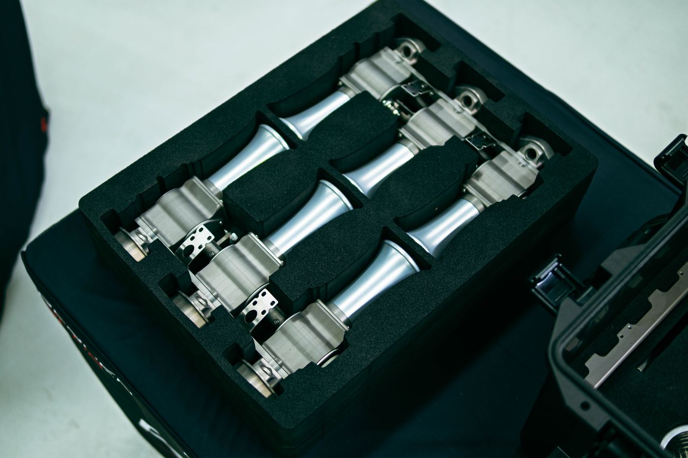 Complete Rennen ITB kit in custom-cut foam: six roller-barrel throttle bodies with velocity stacks, linkage and hardware in the hard transport case